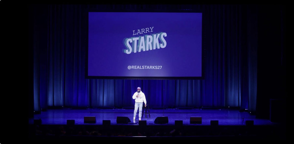 Larry Starks performing stand-up comedy live on stage